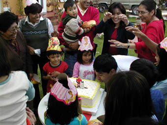 Osvaldo biting birthday cake