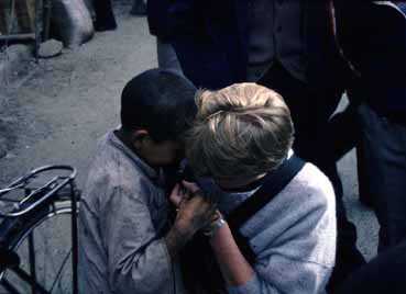 Tibetan boy investigating my microphone