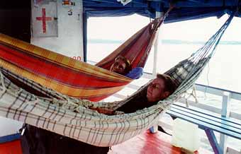 Lykke and Kirsten in hammocks on boat on Rio Negro