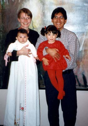 Kamila in the family babtism dress with her family