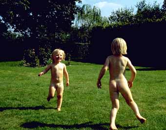 Helle and Lykke naked in grandmother's garden