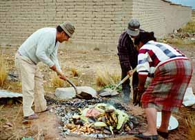 Osvaldo's father and his wife preparing Tiahua