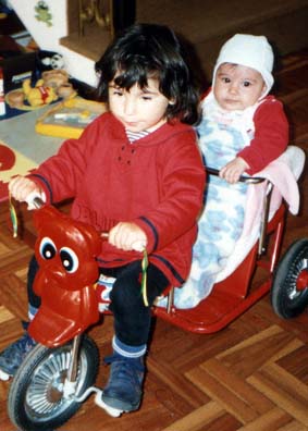 Natasha and Kamila on the tricycle