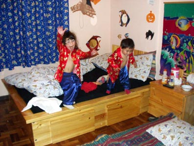 Natasha and Kamila jumping from the bed