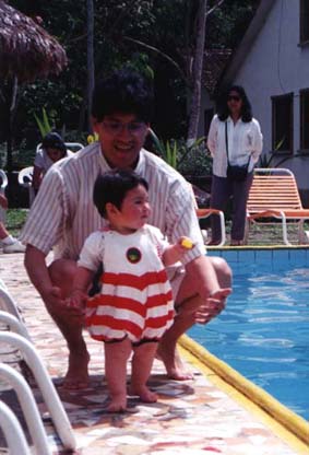 Natasha and Osvaldo by the pool at Rio Selva Resort