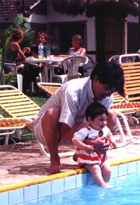 Natasha and Osvaldo by the pool at Rio Selva Resort