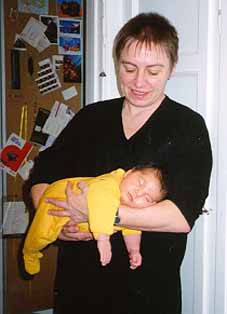 Natasha sleeping in the arms of her grand mother