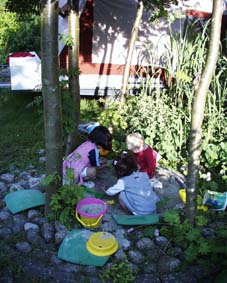 Natasha, Kamila and Mathilde playing in the sand box